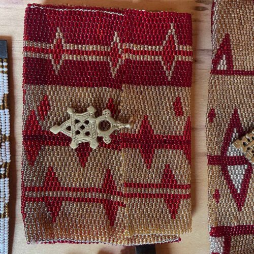 Square red and gold clutch bag with Ethiopian Cross