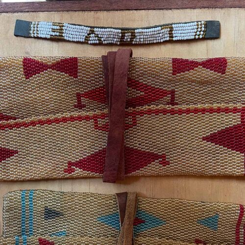 Beige and red clutch bag with leather wrap tie