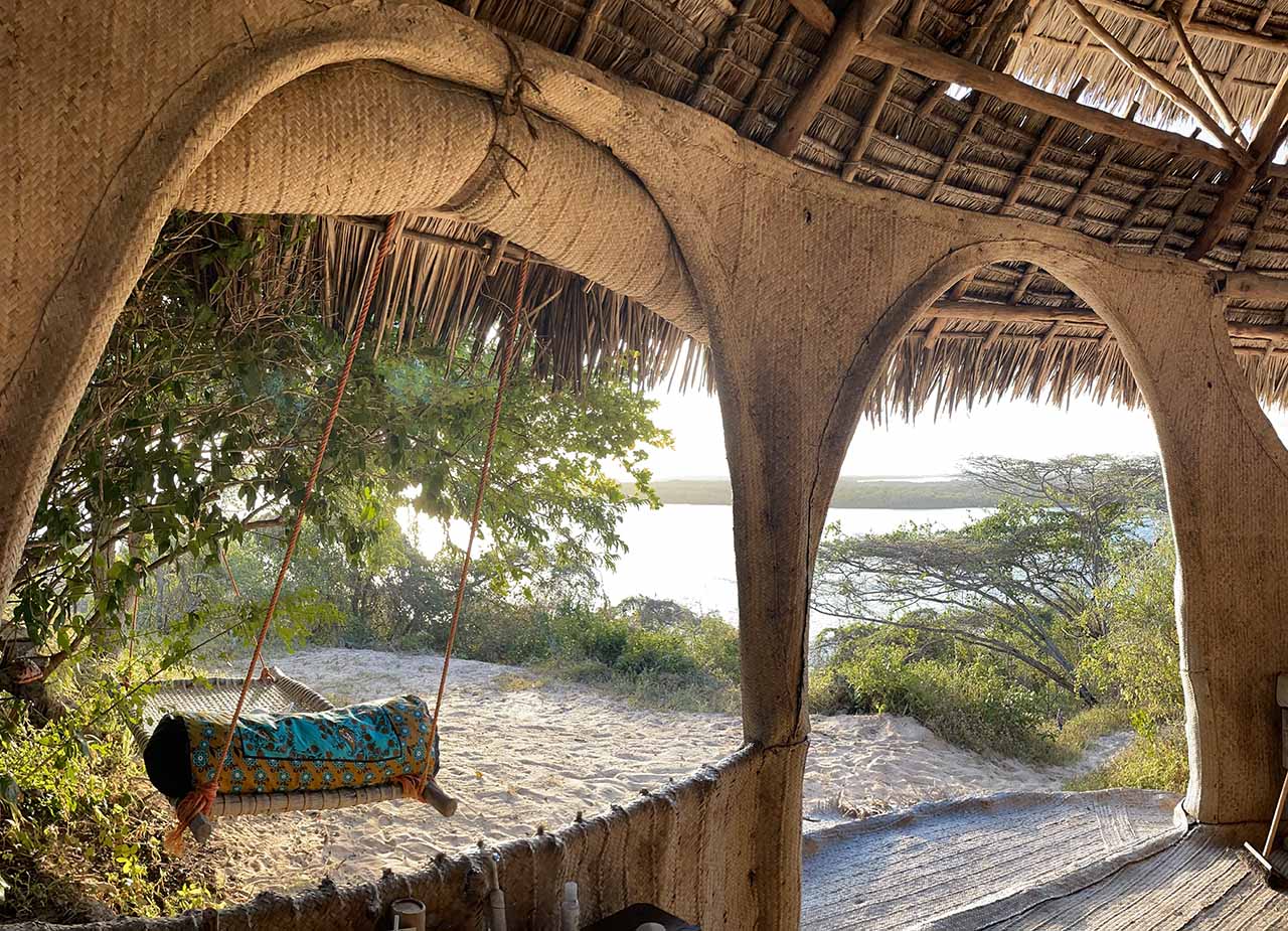 Holiday homes with swing beds set under the trees to relax in with a book